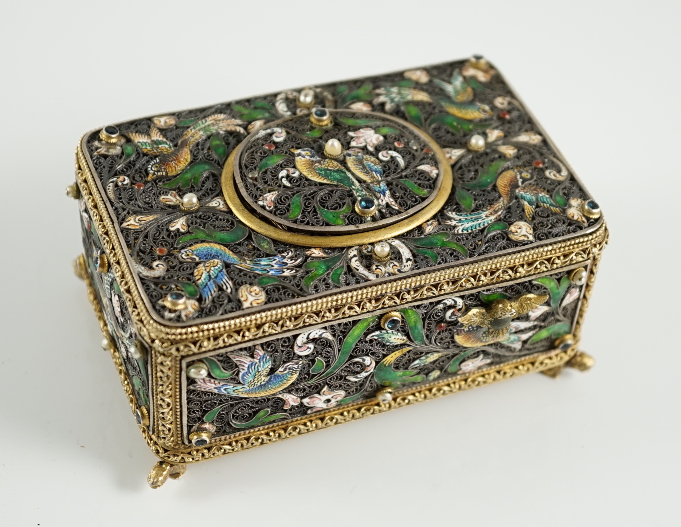 A 19th century Austro-Hungarian 800 standard silver gilt, jewelled and enamelled rectangular singing bird box automaton